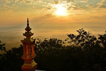 Sunrise over the Lampang city, Bird eye view on Wat Phra That Doi Phra Chan. Lampang Thailand.  