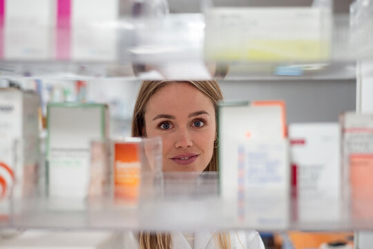 Pharmacist choosing box of remedy