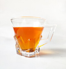 A cup of red tea on a white background.Rooibos tea.red bush tea.
