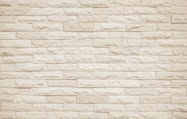 Cream and beige brick wall texture background. Brickwork and stonework flooring interior rock old pattern design. Background of old vintage brick wall backdrop