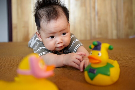 Closeup of Asian baby playing

