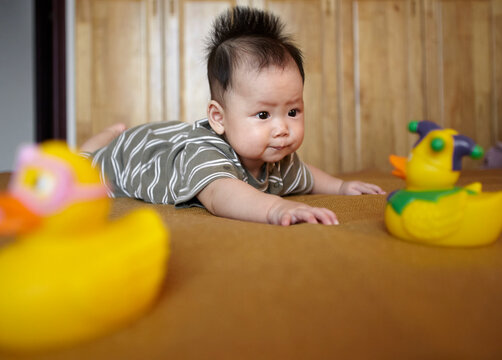 Closeup of Asian baby playing

