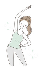 片方の手を腰にあて、もう片方の手を上に伸ばしストレッチをする女性