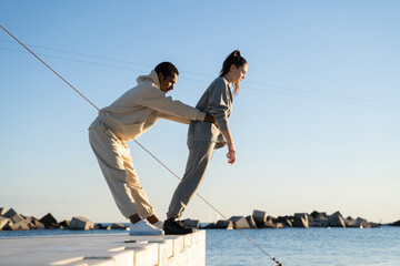 Friends balancing helping each other 