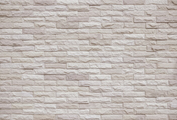 Cream and white brick wall texture background. Brickwork and stonework flooring interior rock old pattern old vintage brick wall backdrop decoration