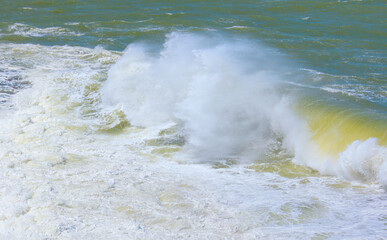 Rocky coastline on Diaz Point with strong sea wave - Luederitz, Namibia
