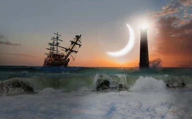 Gordijnen Sailing old ship in storm sea with lighthouse - Night sky with crescent in the clouds © muratart