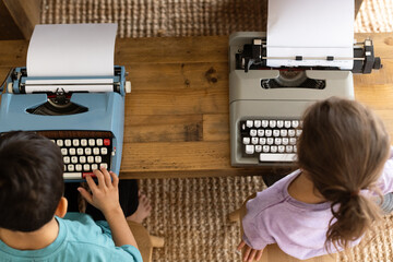 Kids typing on typewriters