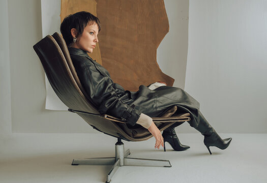 Fashion Top Model In Front of Abstract Paintings.