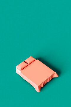 Pink bed on a green background with copy space