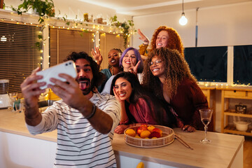 Male taking selfie with girlfriends
