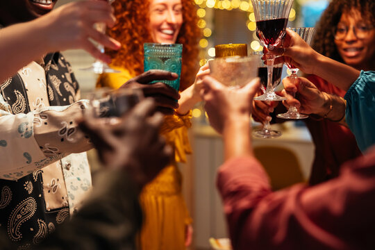 Crop people with wine celebrating Christmas