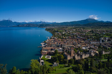 Panorama of the historic town of Lazise. Aerial view of the Scaliger Castle of Lazise. Top view of the historic part of the city Lazise Castle on the coastline of Lake Garda. Lazise Lake Garda Italy