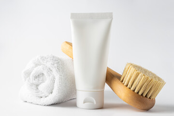 SPA cosmetics, woman body and skincare products on white background. Natural bristle dry massage...