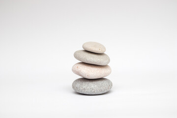 Fototapeta na wymiar Pebble stones balance on white background
