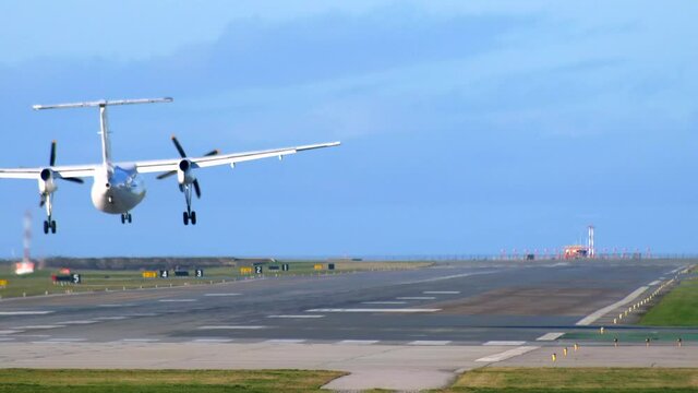 Turboprop Propeller Passenger Aircraft Landing and Vacating the Runway