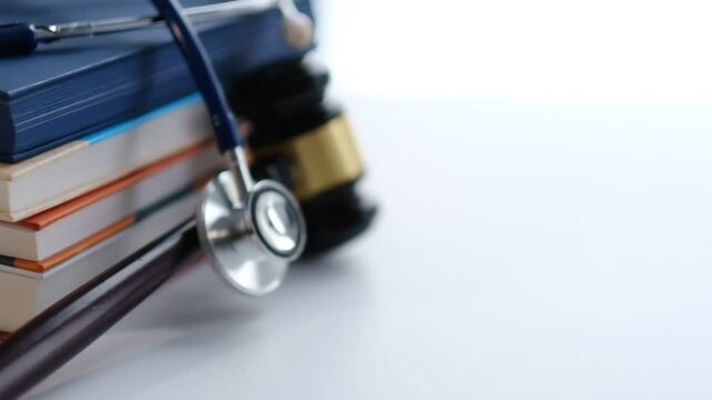 Gavel and stethoscope. medical jurisprudence. legal definition of medical malpractice. attorney. common errors doctors, nurses and hospitals make.