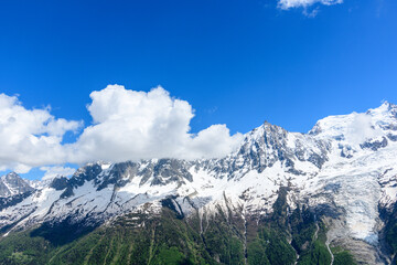Fototapeta na wymiar The Mont Blanc Massif and its eternal snows in the Mont Blanc Massif in Europe, France, the Alps, towards Chamonix, in summer, on a sunny day.