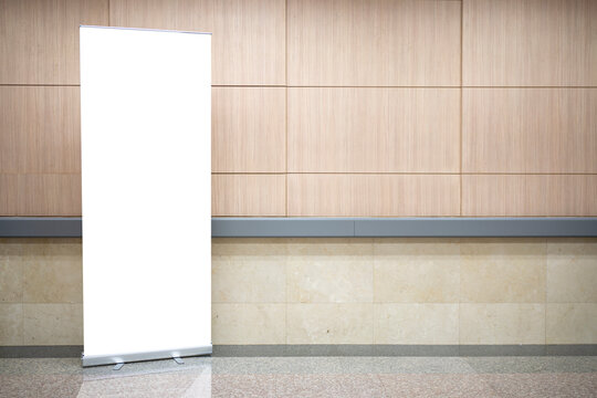 Blank roll up stand banner. Blank mockup for presentation isolated on wall background