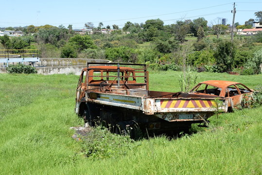 Rusted vehicular wreck abandoned in a wastewater treatment facility