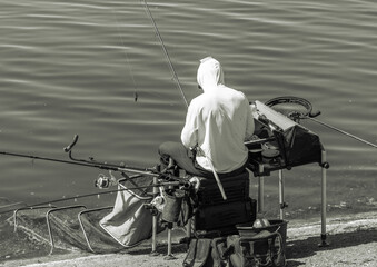 Obraz premium A man fishing with a rod