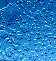 Gold patterns from frost on glass as a background.