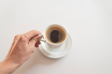 Cup of coffee espresso in woman's hand.
turkish coffee concept.world coffee day concept.
