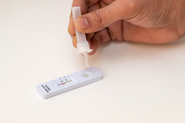 Corona Antigen Rapid Test kit and masks on white background