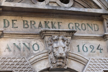 Sculpted Lion Head Decorating a Stone Gate with the Inscription Anno 1624 in Amsterdam, Netherlands