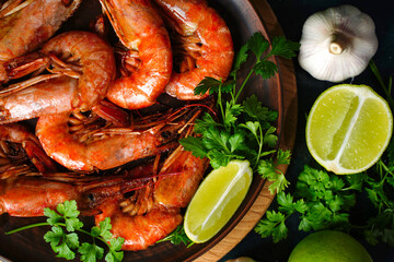 Close up Fried langoustines and shrimps on a plate. Pickled in garlic and lime. Top view