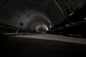 Underground facility with a big tunnel leading deep down. Metro - subway construction site.