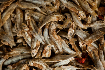 sardine fish sprats smoked or salted seafood mackerel at a street food market stand. food...