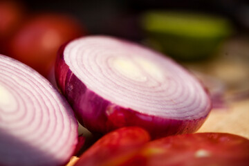 Tomatoes and onions on a kitchen cooking boards. Food background.