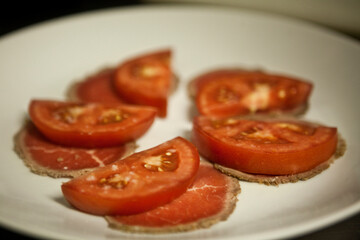 Tomatoes and onions on a kitchen cooking boards. Food background.