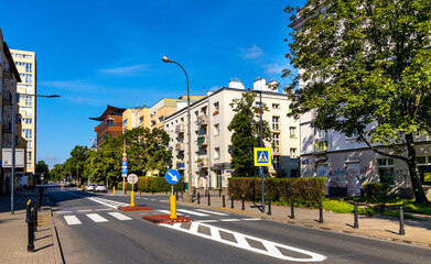 Panoramic view of Madalinskiego street tenement residential houses with Warsaw School of Economics SGH building in Mokotow district of Warsaw in Poland © Art Media Factory