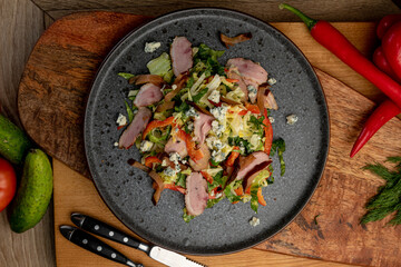 salad of fresh vegetables and smoked meat. fresh food. fresh vegetables