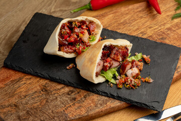 meat tacos with minced meat and vegetables. a traditional dish