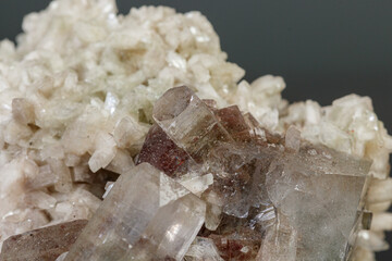 macro mineral stone Apophyllite stilbite on a gray background
