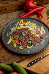 salad of fresh vegetables and smoked meat. fresh food. fresh vegetables