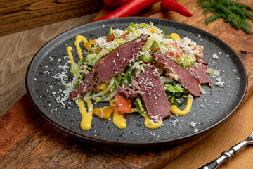 salad of fresh vegetables and smoked meat. fresh food. fresh vegetables