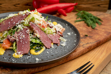 salad of fresh vegetables and smoked meat. fresh food. fresh vegetables