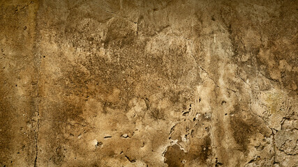 dark beige dirty cracked background or backdrop from an old wall with concrete plaster