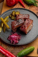 smoked meat with pickled cabbage and pickled cucumbers