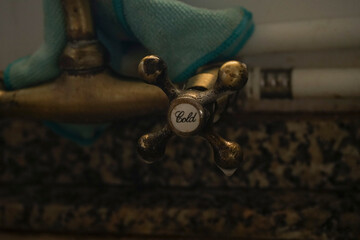 Retro water tap in an old sink