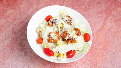 Caesar chicken salad plate isolated close up