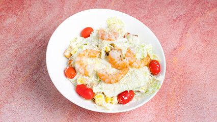 Prawns caesar salad plate isolated close up