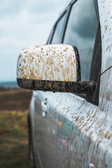 suv car with dirty wheels in mud