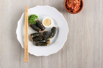 Deep Fried Seaweed, made from marinated chicken rolled in seaweed paper and then deep fried