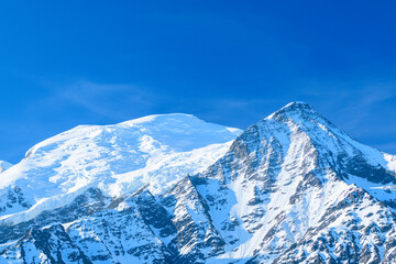 Mont Blanc and the Aiguille du Gouter in Europe, France, the Alps, towards Chamonix, in summer, on a sunny day.
