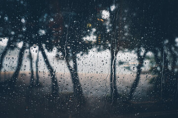 rain drops on window at a beach